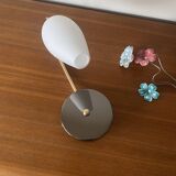 Swan neck wall light in brass and white opaline glass tulip.
