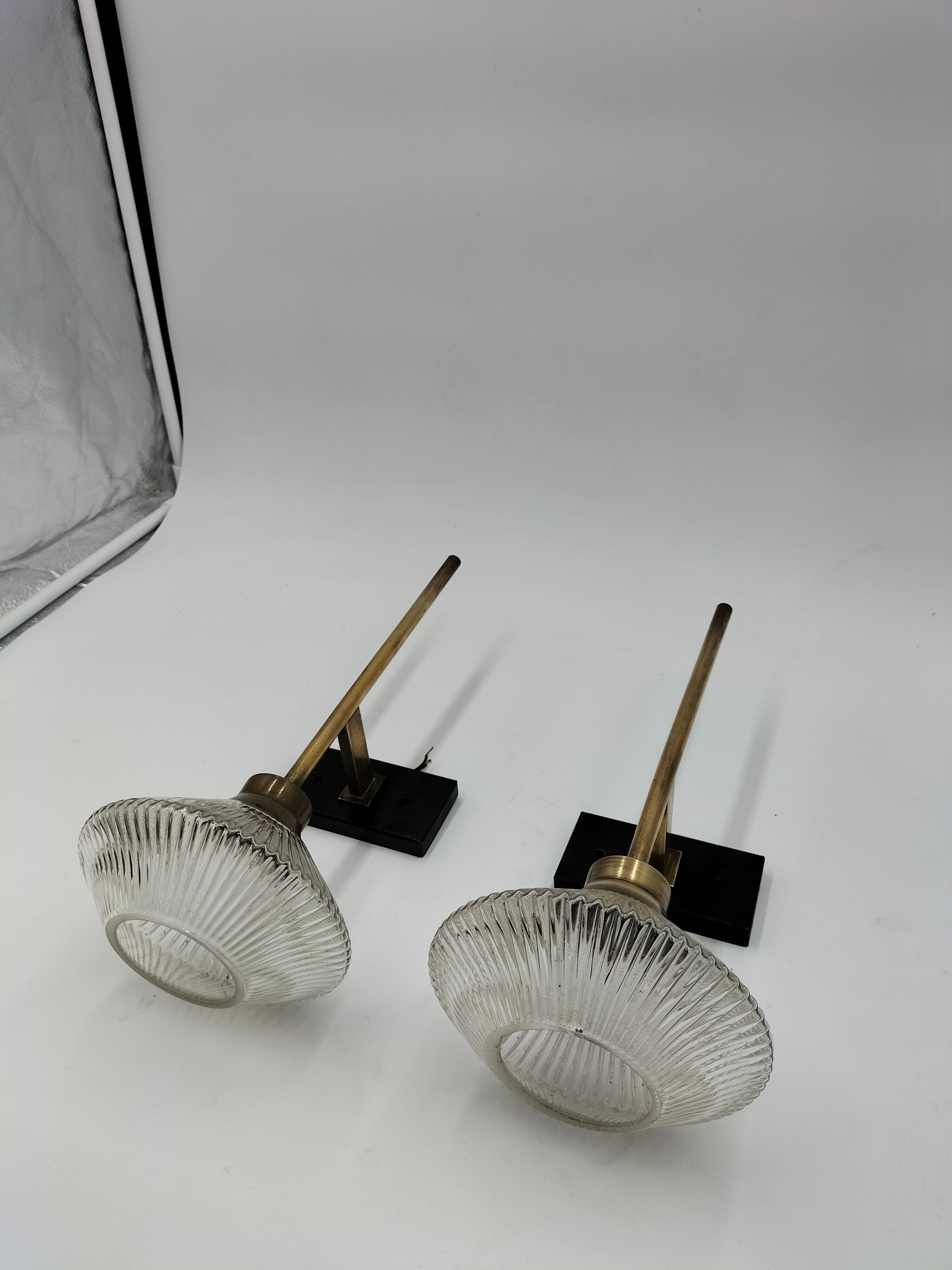 Pair of brass and glass wall lamps