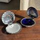 Vintage silver-plated shell butter dish with blue bowl.