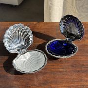 Vintage silver-plated shell butter dish with blue bowl.