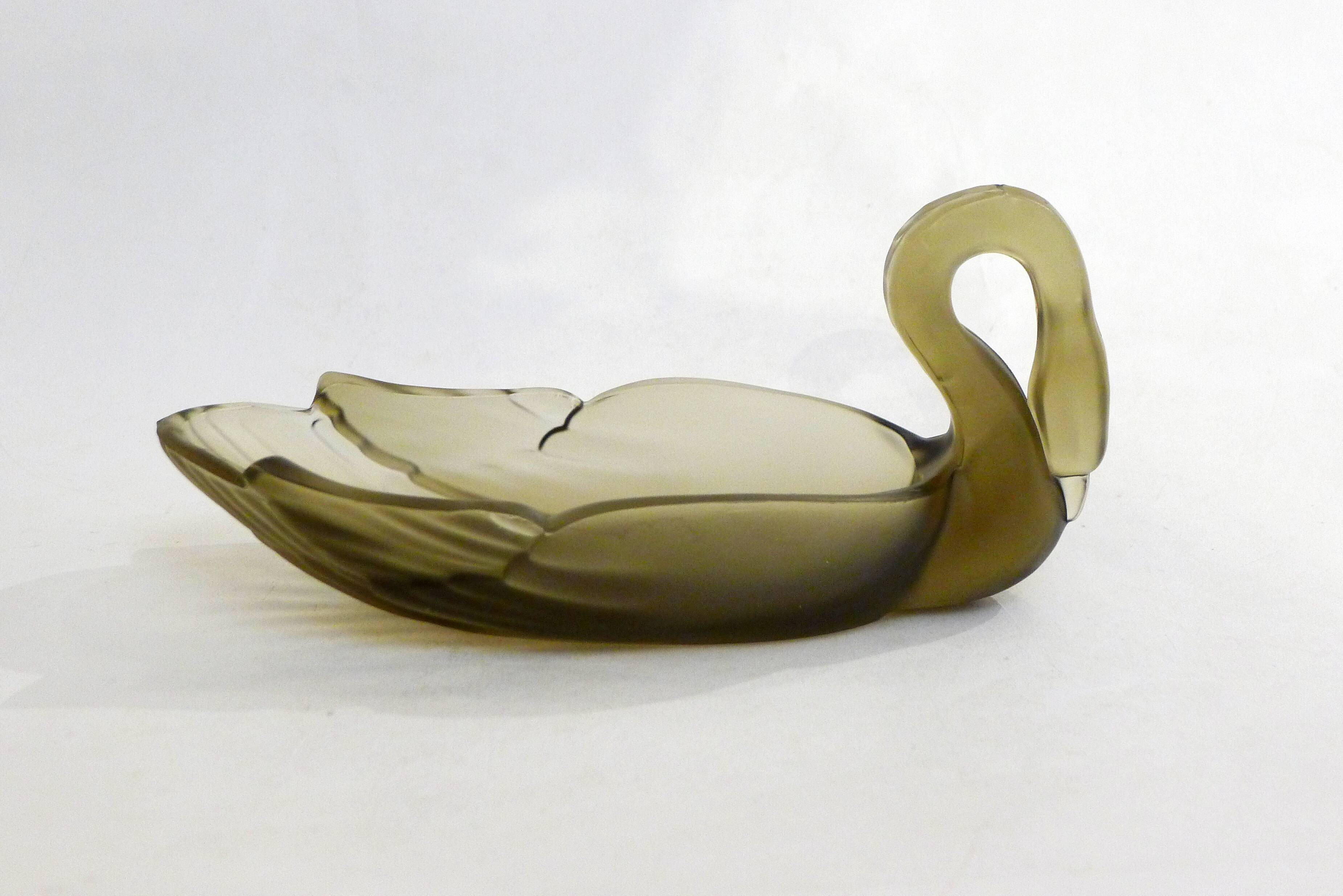 Smoked glass swan pocket emptier