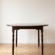 Traditional round wooden dining table