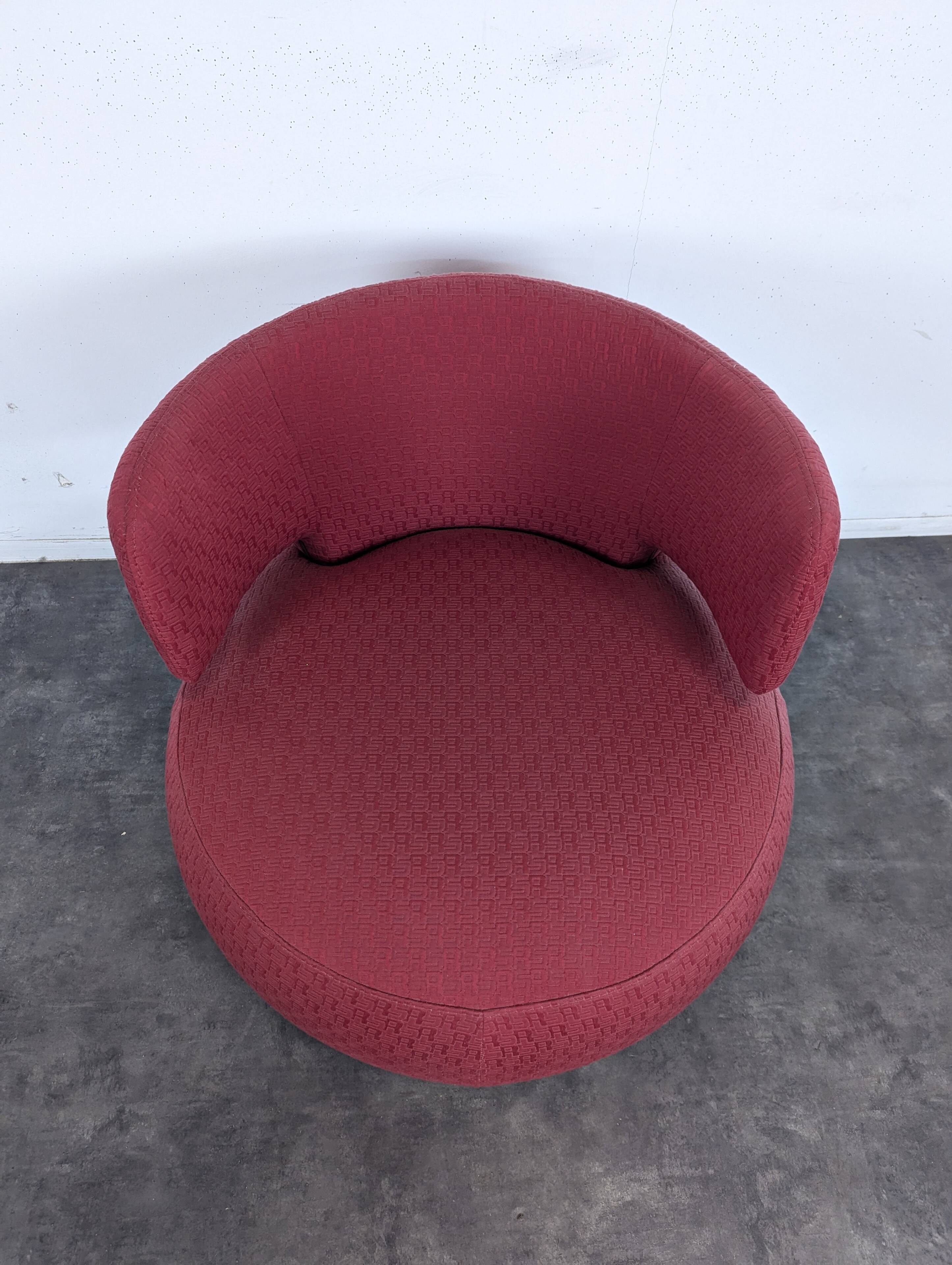 Roche Bobois swivel chair in red fabric with 2000s patterns.