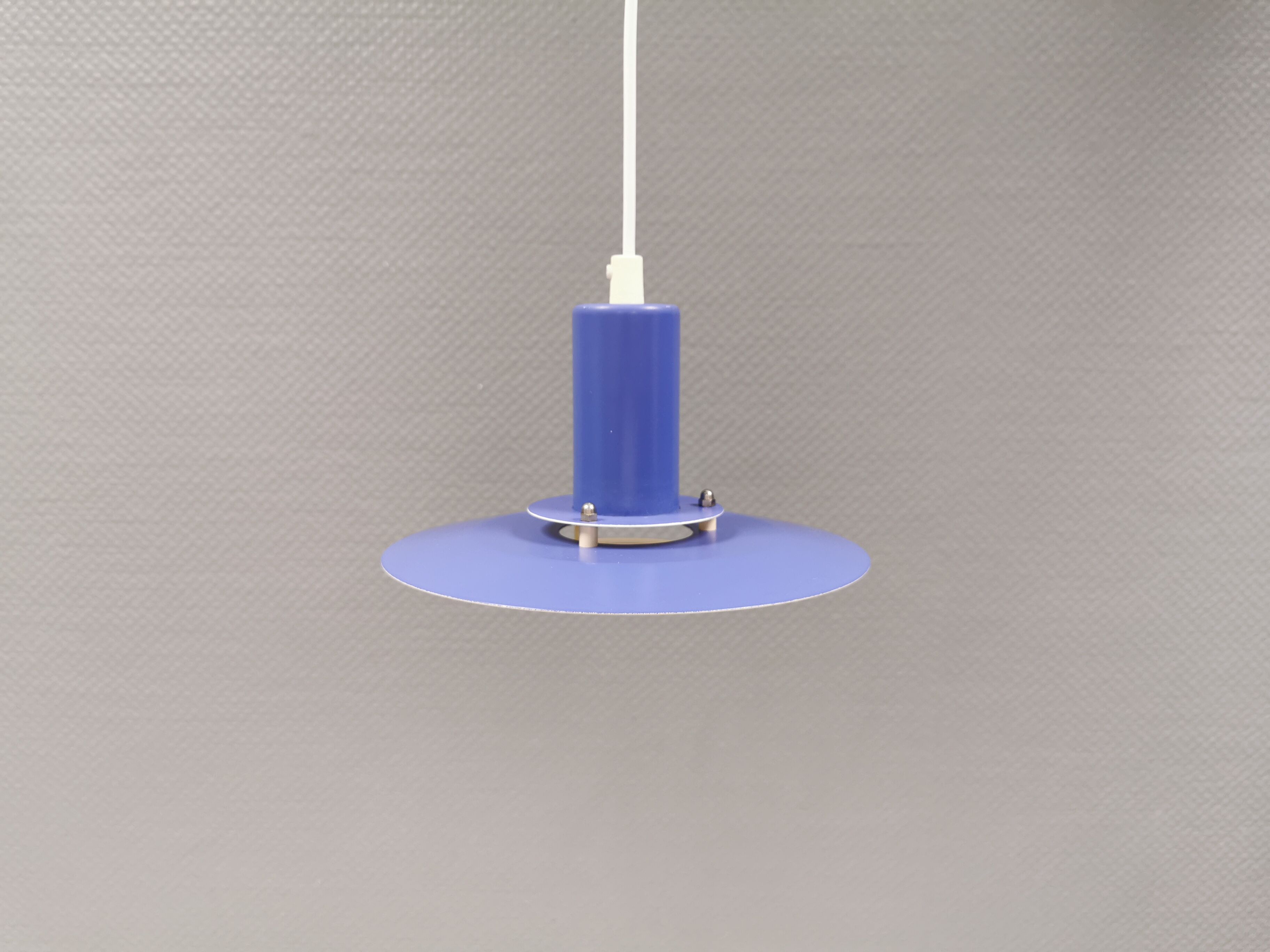 A blue minimalist hanging lamp from Lyfa Denmark 1980s.