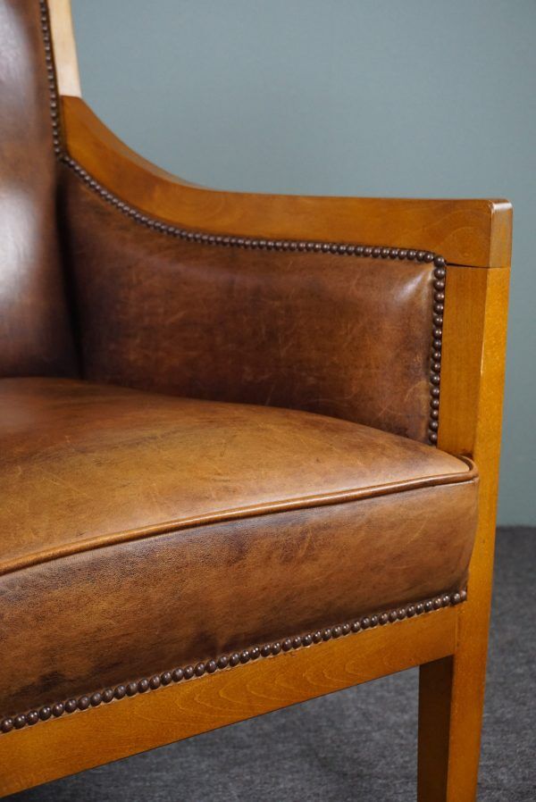 Armchair in sheepskin with beautiful light wood