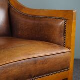 Armchair in sheepskin with beautiful light wood