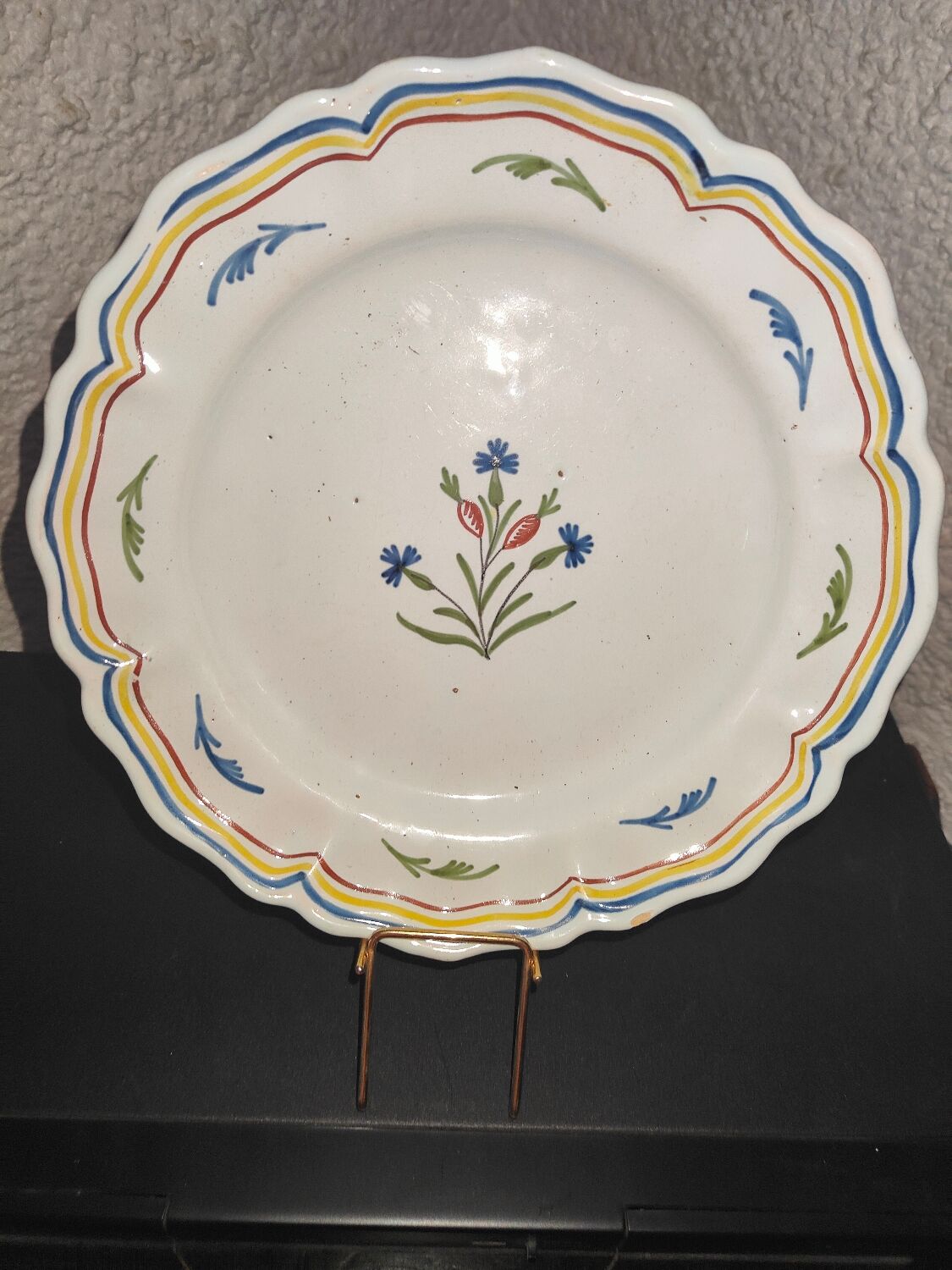 Old plate in earthenware of Nevers eighteenth Century with chantourné edges