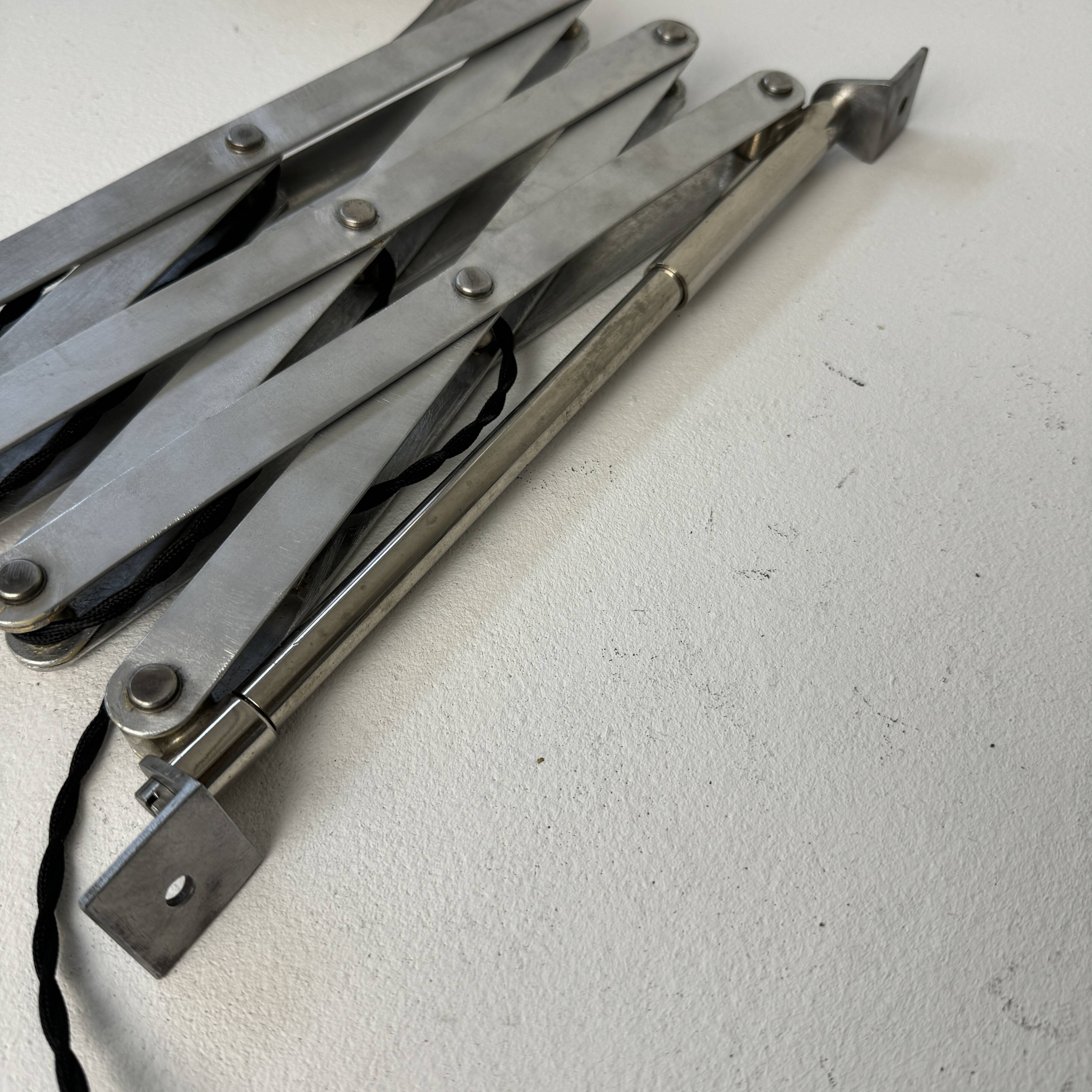 Old large industrial accordion wall lamp