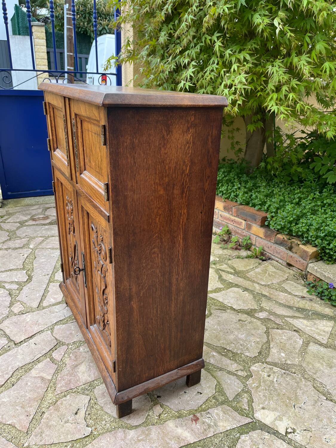 Low carved wooden sideboard