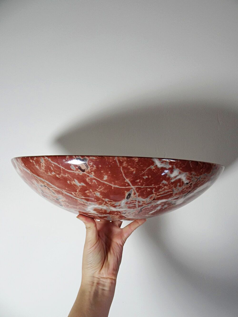 Pair of vintage wall sconces in faux red marble ceramic, 1990s.