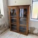Glass-fronted walnut library 1900