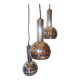 Raak three-light space age orange pendant lamp, 1970s, Netherlands