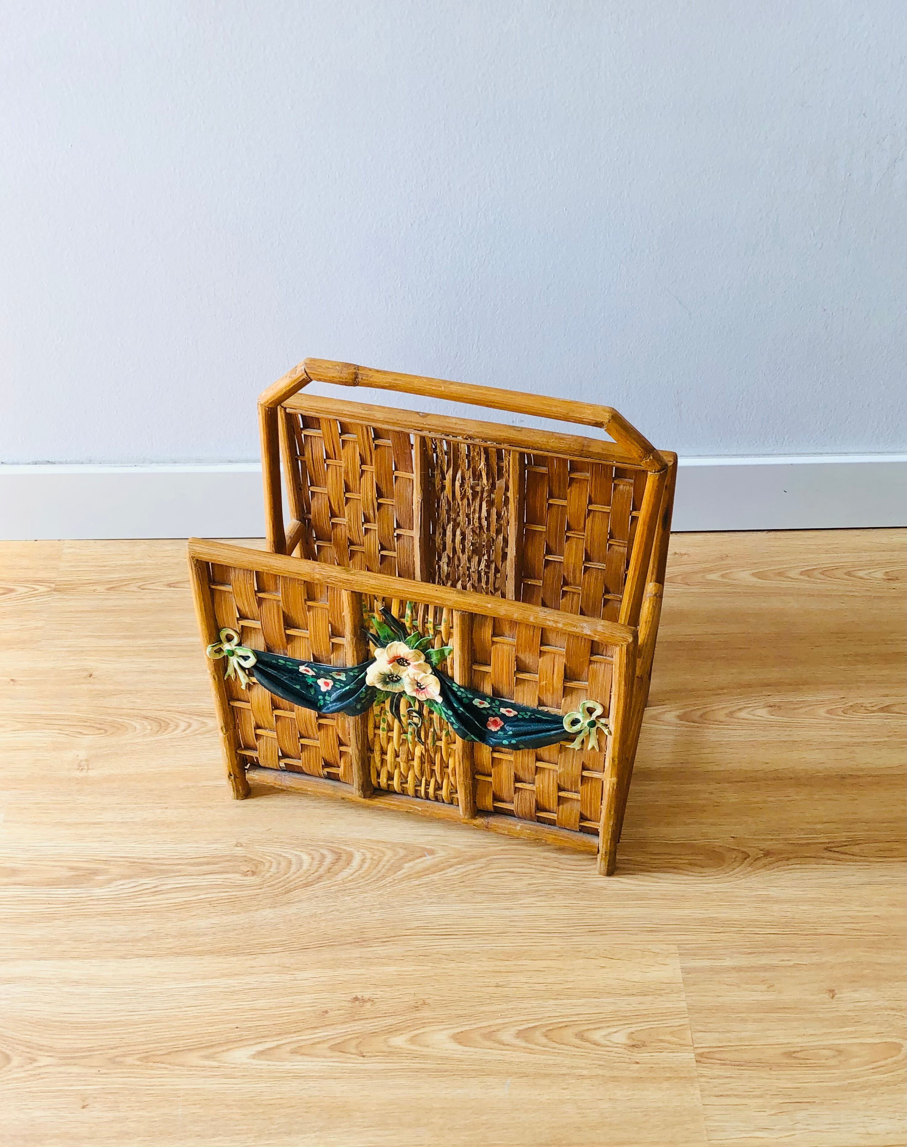 Vintage rattan magazine holder with floral decoration