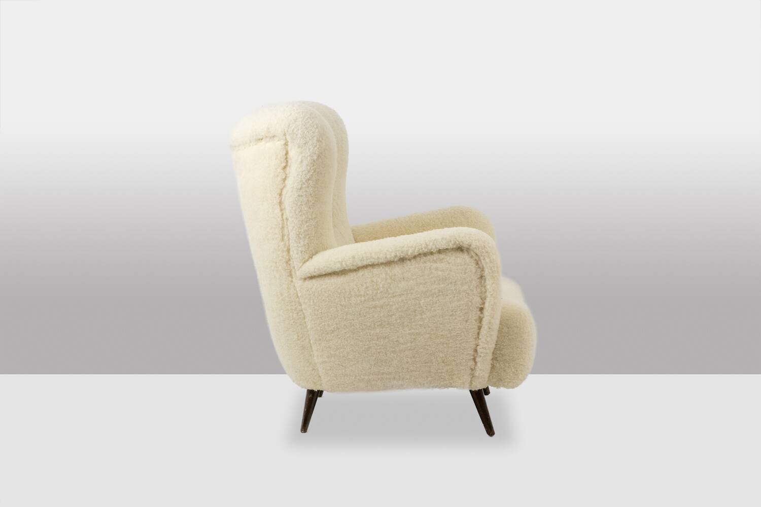 Armchair, or bergère, with its boucle fabric. 1950s