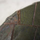 Pouf in black/green leather