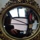 Pair of antique witch mirrors, curved glass, bronze frame