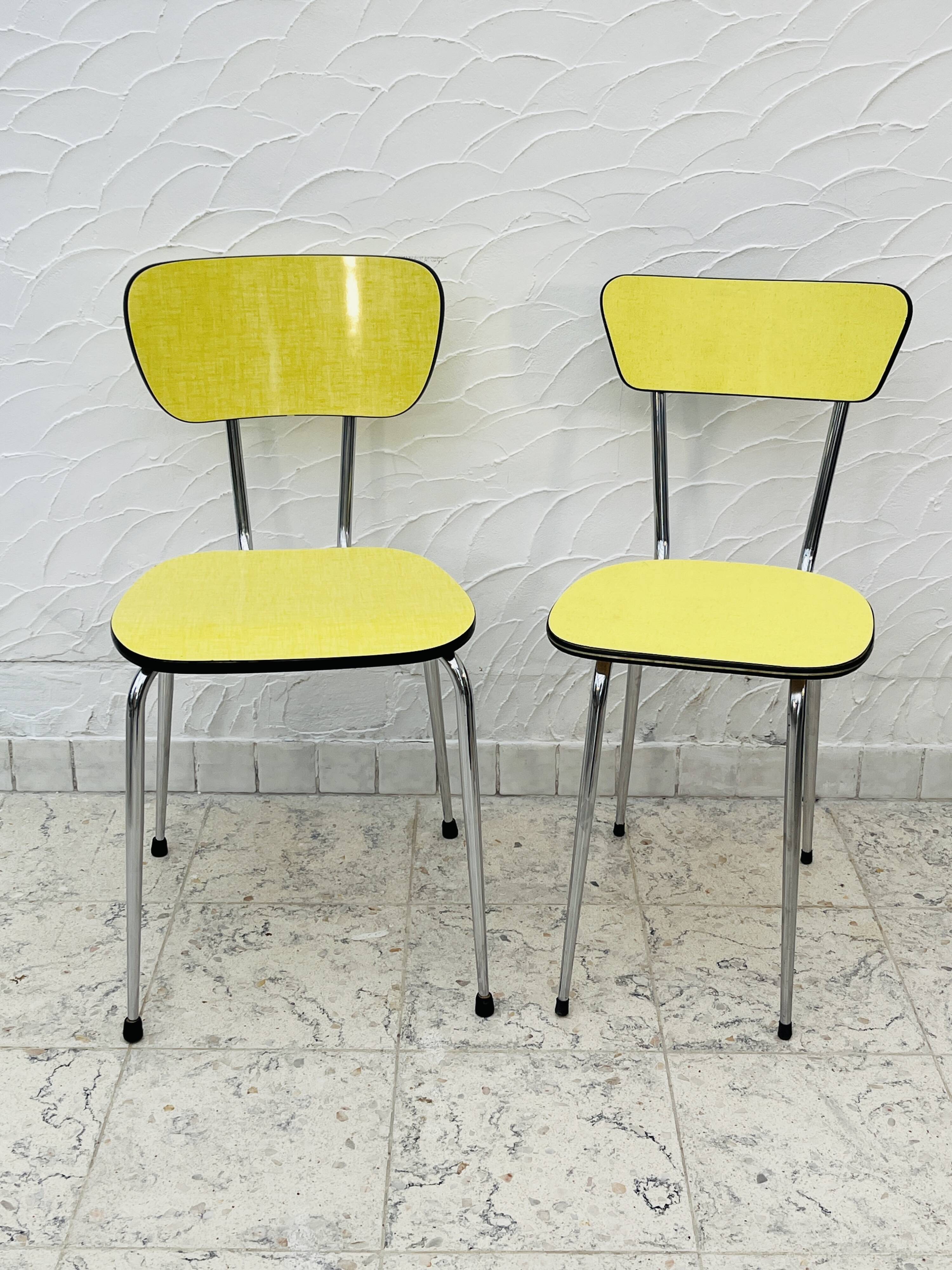 Pair of vintage yellow chrome Formica kitchen chairs.