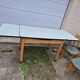 Vintage Scandinavian table and chair set with a wooden frame and formica top.