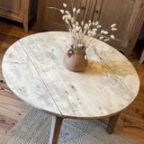Antique round coffee table in raw solid wood
