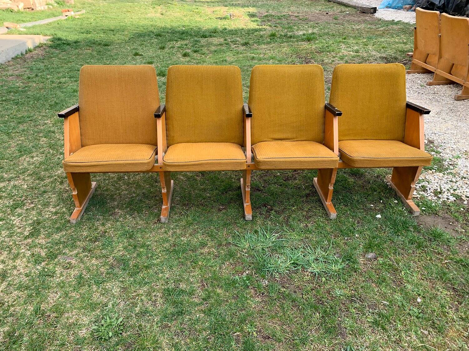 Set of 4 mid-century cinema seats in yellow fabric and light wood, 1950s.