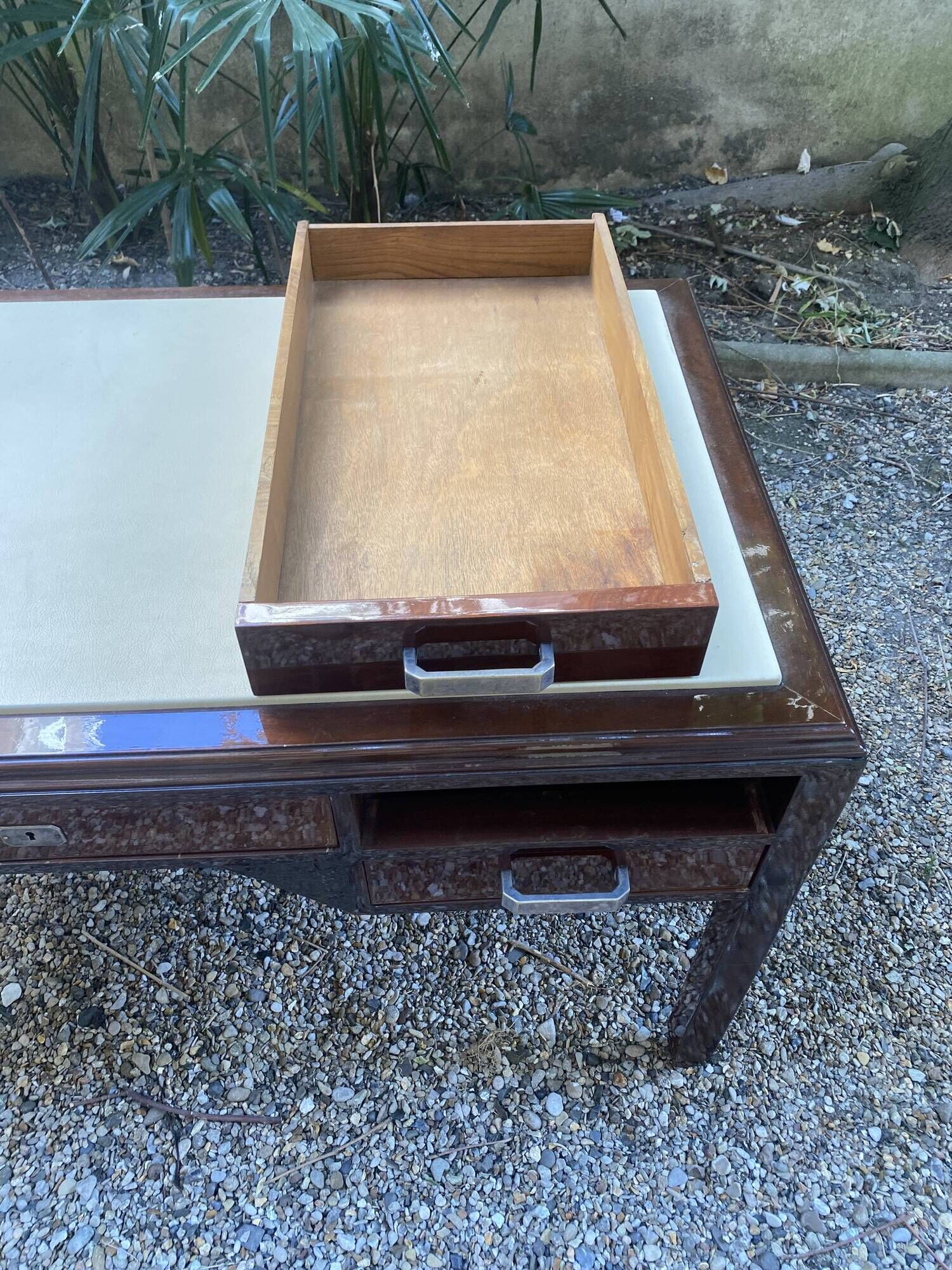 Art Deco desk in varnished mahogany.