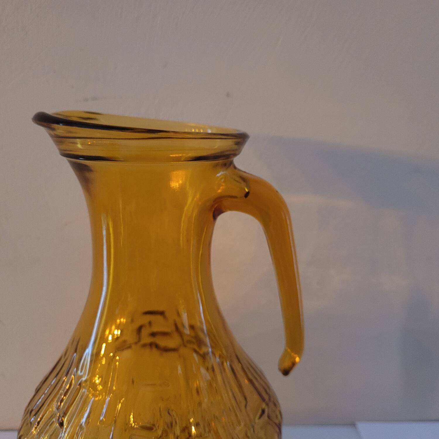 Amber relief glass pitcher. 1970s