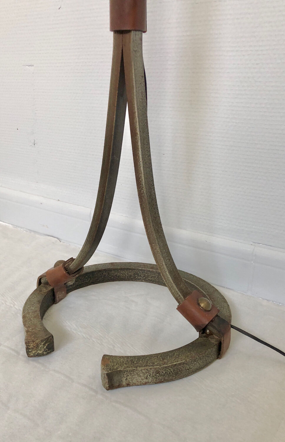 Hammered wrought iron and leather floor lamp by Jean Pierre Rickaert, 1950s