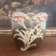 Antique cache-pot from the 1900s in majolica with a raised floral decoration in pink, very decorative.