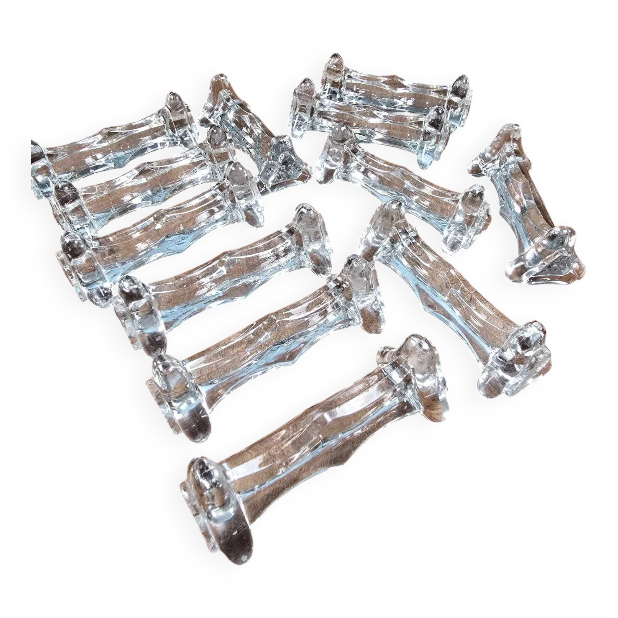 Set of 12 antique knife and fork rests in thick transparent glass.