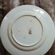 13 mismatched flat plates in ironstone