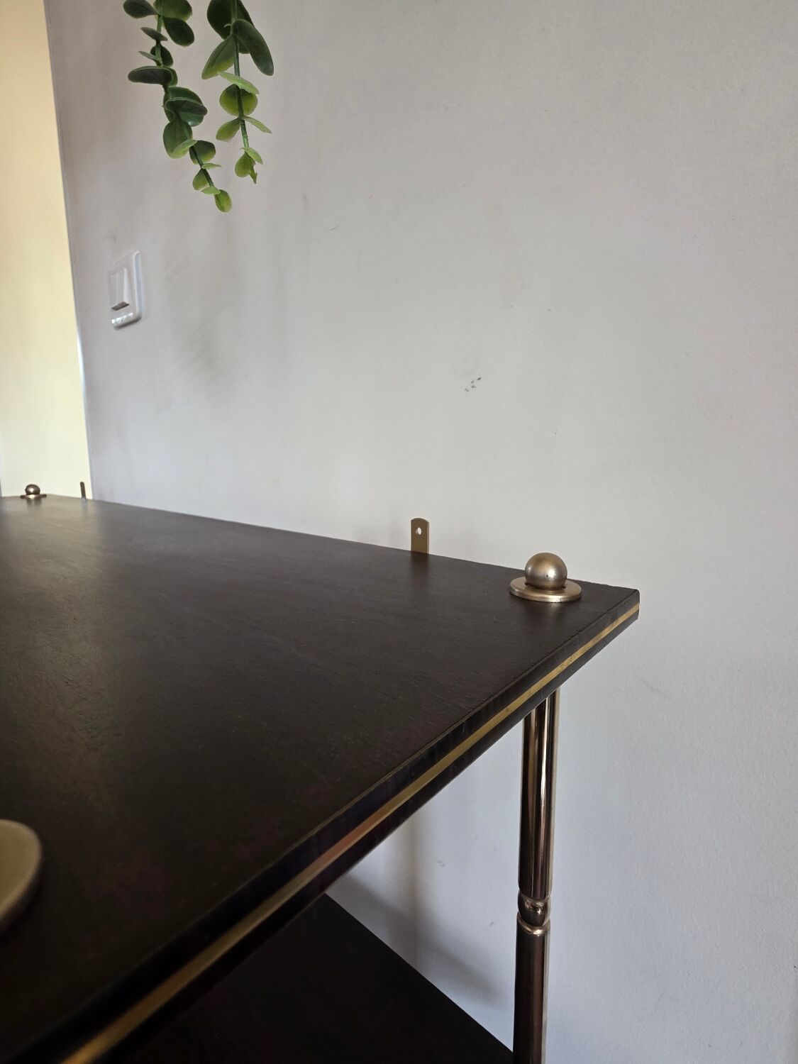 Wooden shelf with gold metal