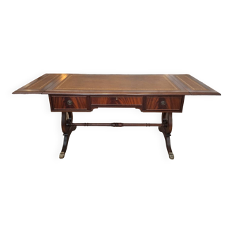 English desk in solid mahogany with lion paws. Leather top