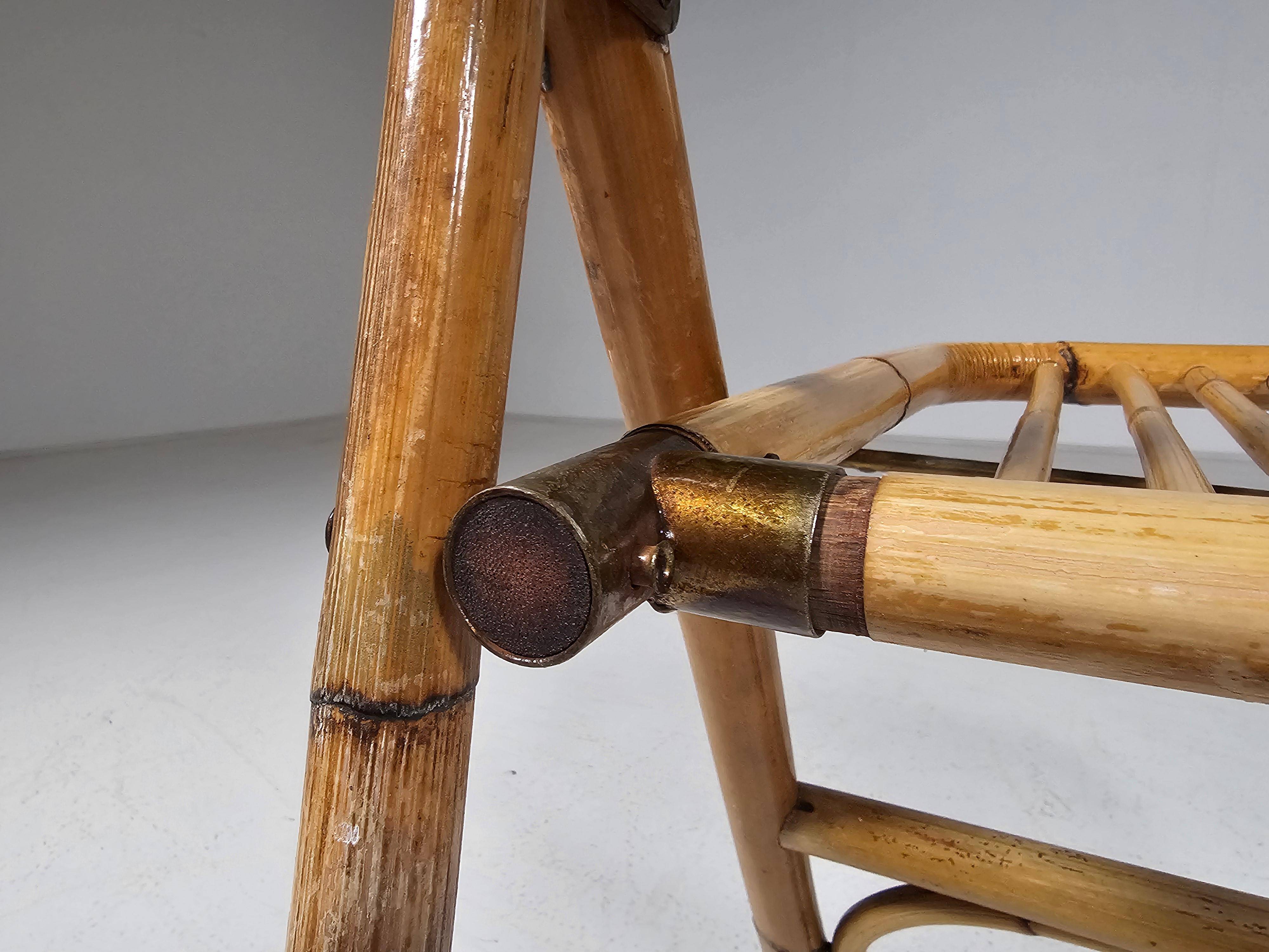 Set of 4 Dal Vera bamboo folding chairs, brass details, Italy, 1960s.