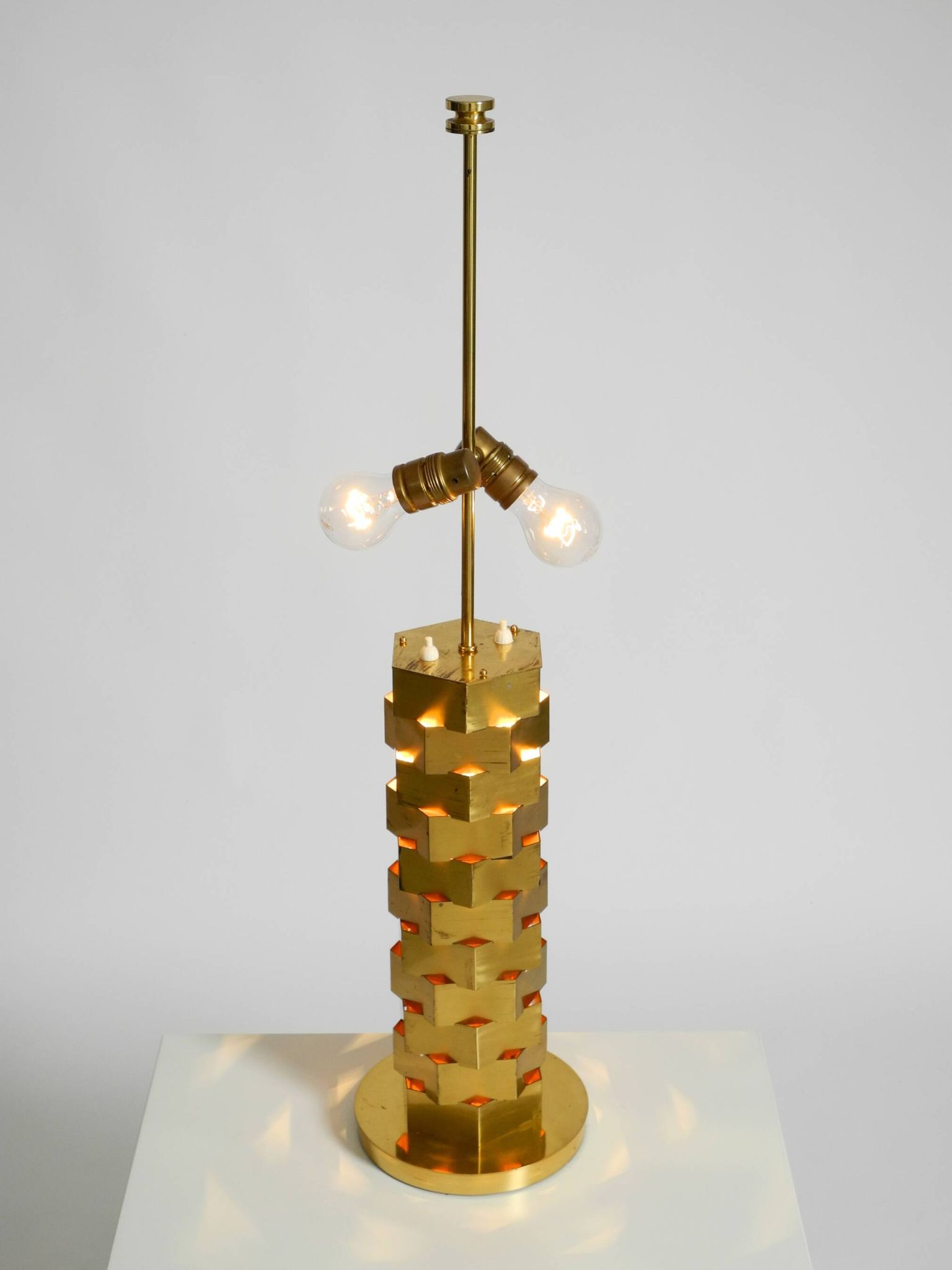 1960s brass table lamp by Vereinigte Werkstätten with an illuminated base