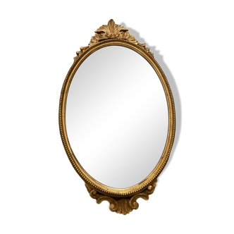 Oval golden mirror