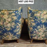 Pair of vintage armchairs with enveloping backrest.