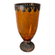 Vintage amber glass vase on a pedestal