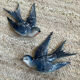 Old pair of porcelain birds for wall decoration.
