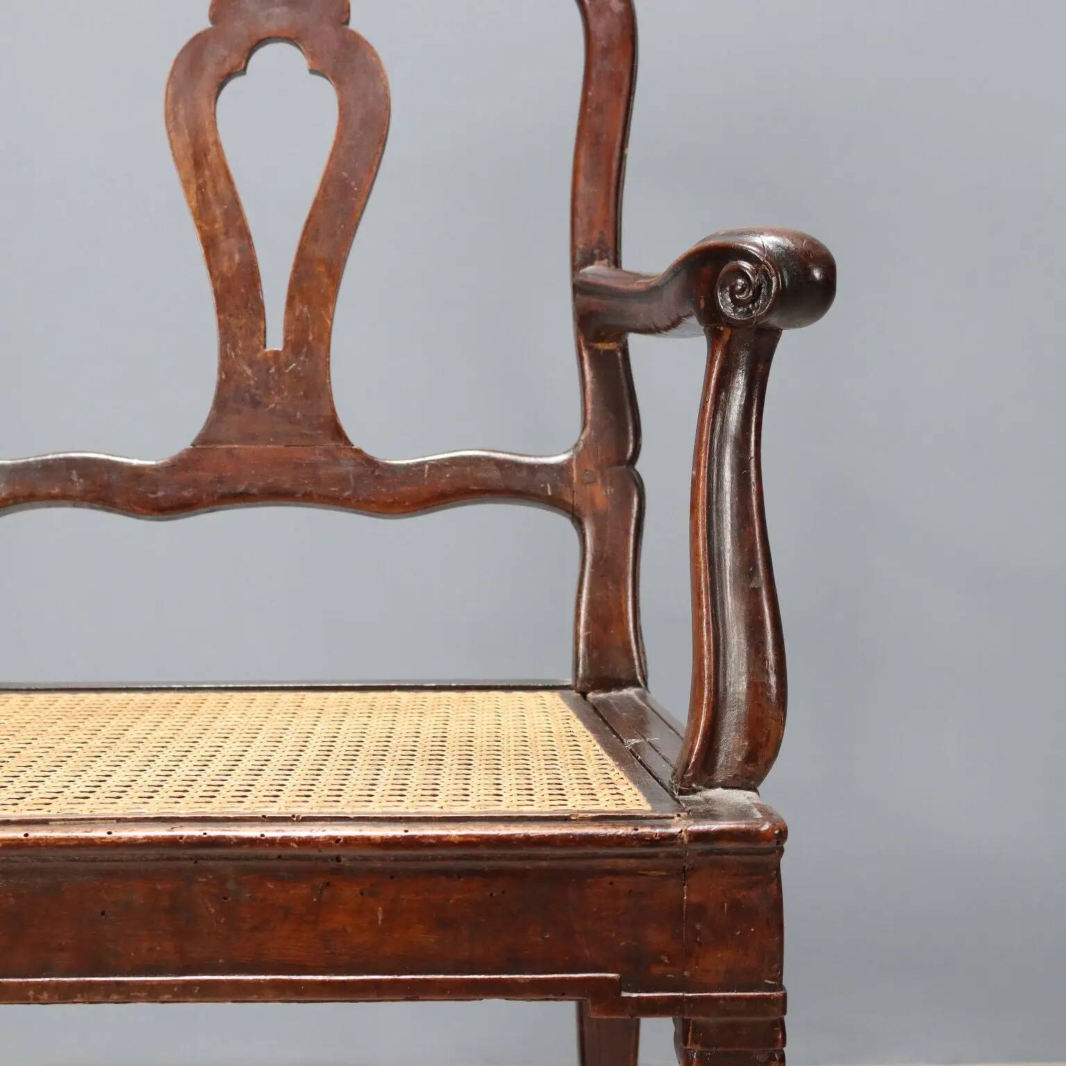 Antique walnut armchair with caned seat, Italy, 18th century