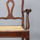 Antique walnut armchair with caned seat, Italy, 18th century