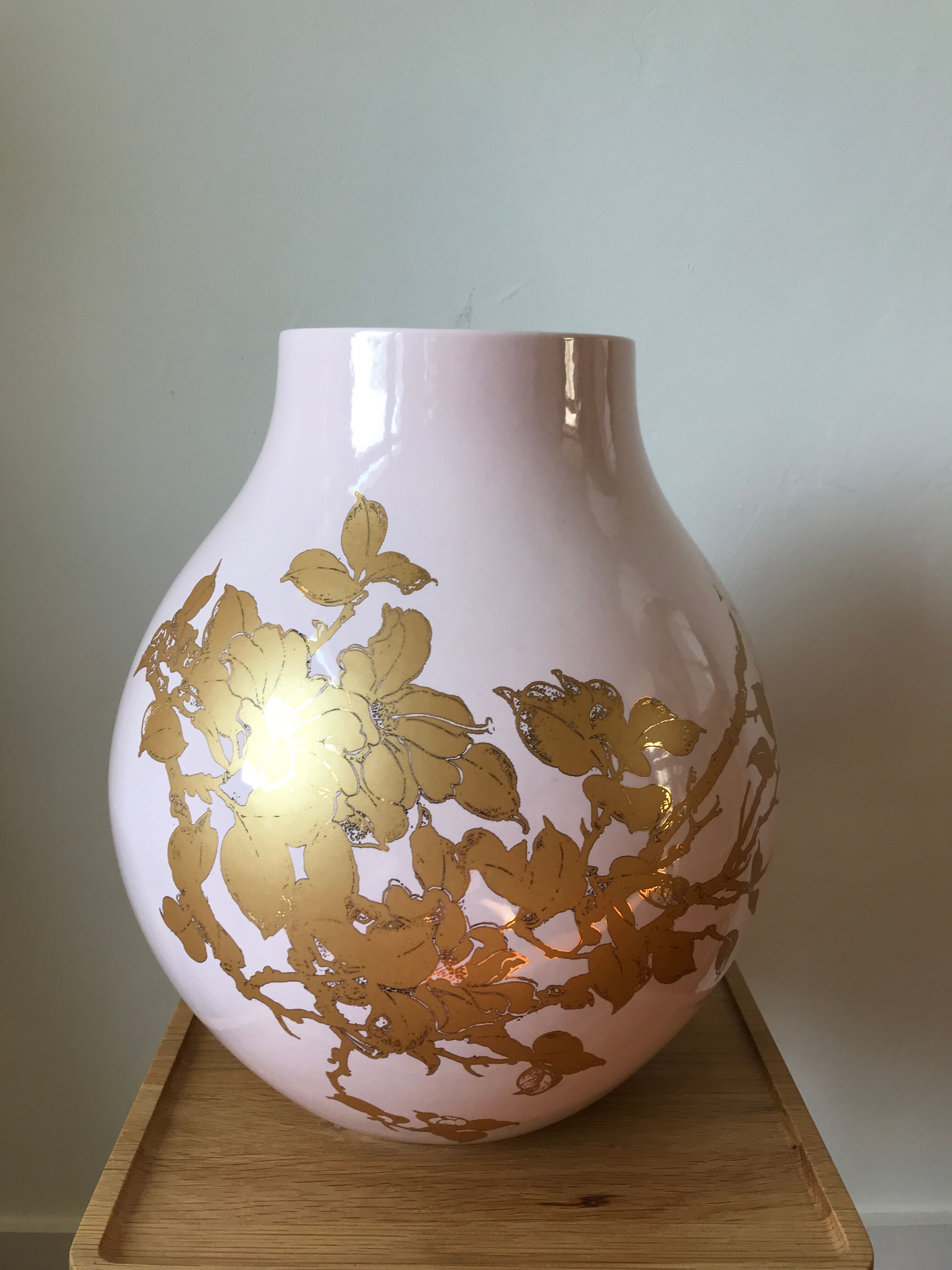 Pale pink and golden earthenware vase