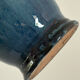 Decorative deep blue glazed ceramic vase with twin handles.
