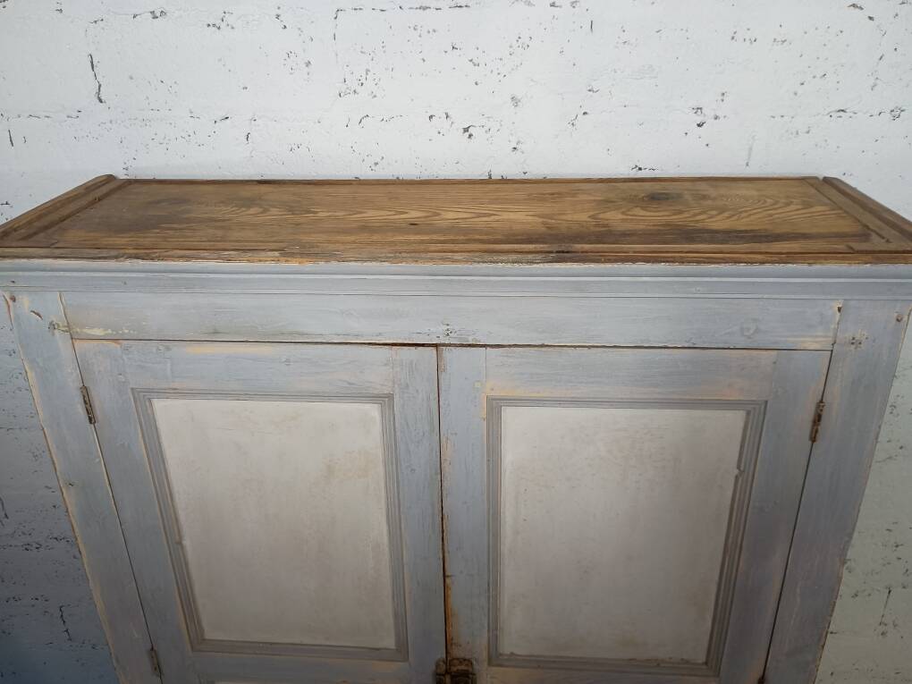 Low Parisian wardrobe with two doors, made of fir with original patina