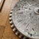 Antique ceiling light with transparent glass and white metal.