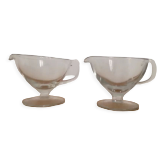 Elegant pair of glass saucières with pouring cradle