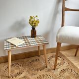 Small mosaic bedside table with tapered legs.