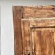 Rustic and vintage wardrobe in raw wood, wabi-sabi style.