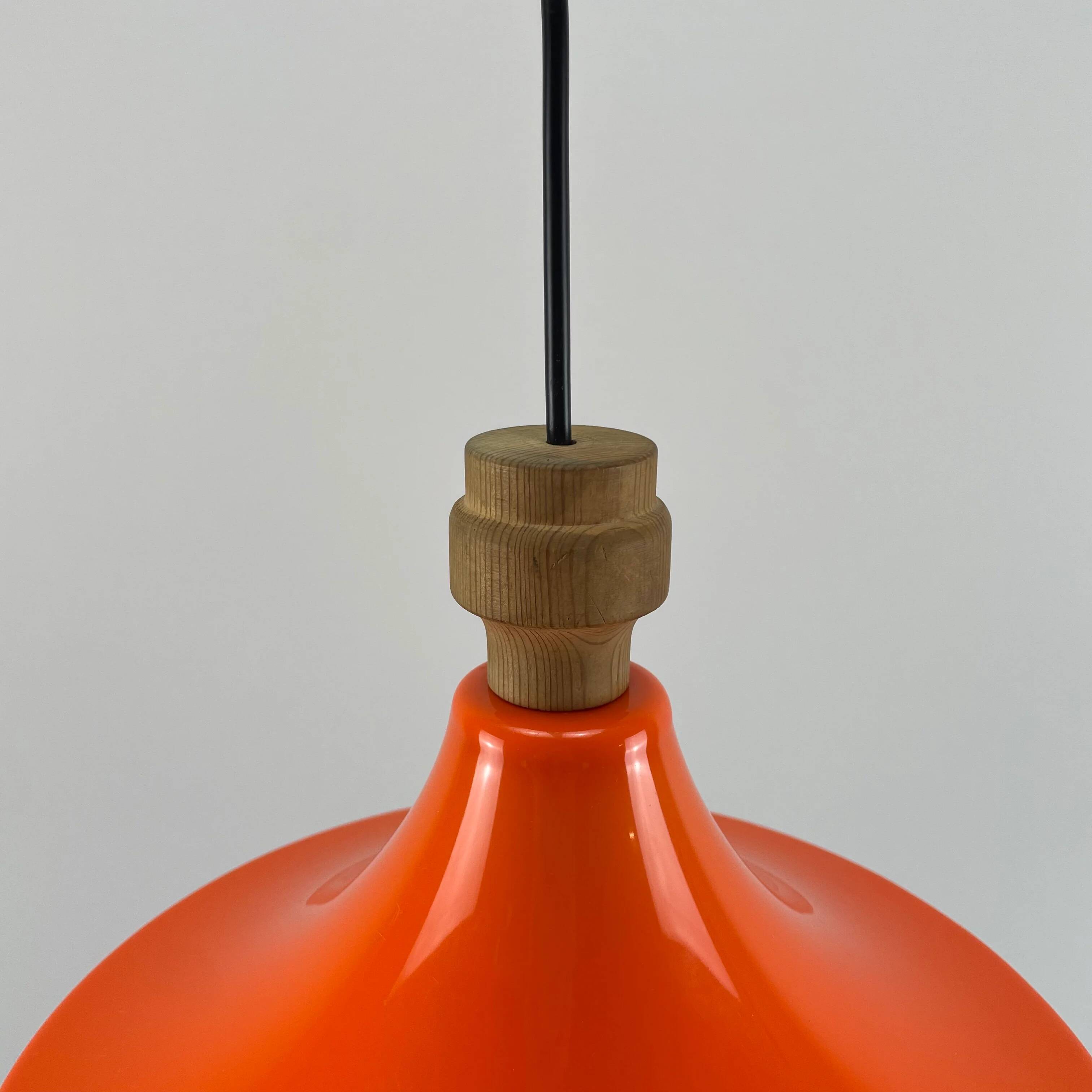 1970s orange Scandinavian suspension light in plexiglass shaped like a UFO.