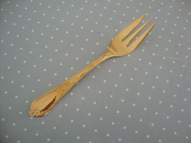 Golden metal cake forks