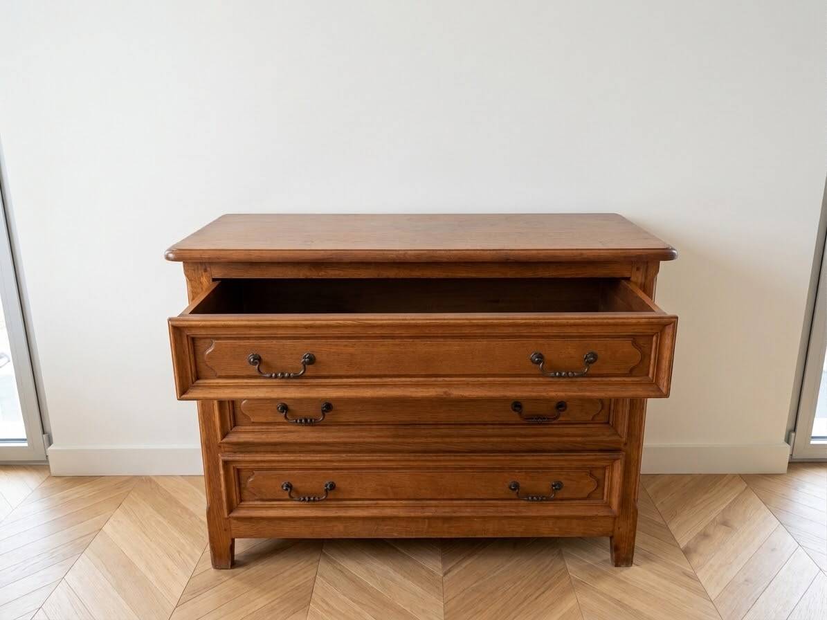 Antique wooden chest of drawers with three drawers.